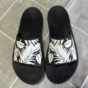Olukai black and white slip on sandal.  - size 8